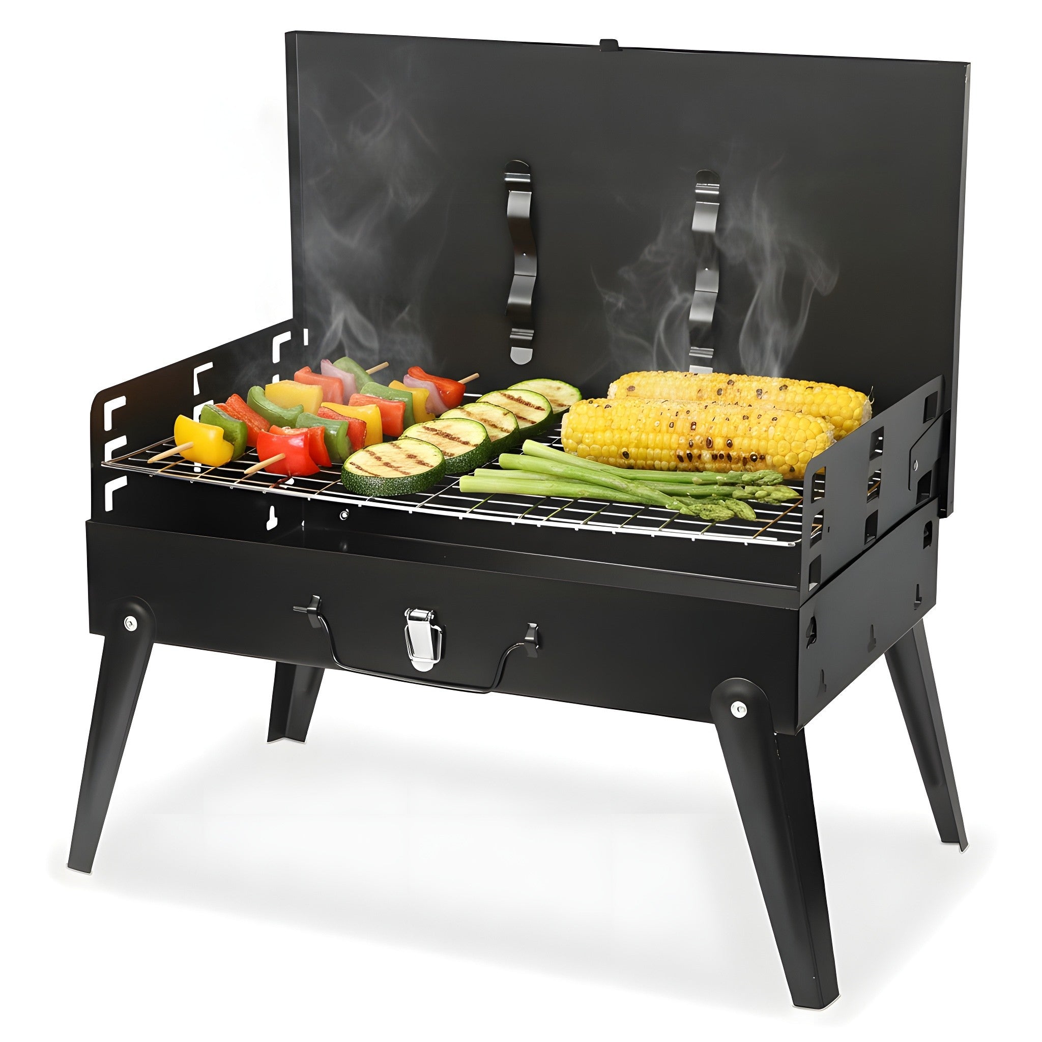 Black portable grill with vegetables cooking on a white background