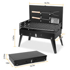 Black portable grill with dimensions on a white background