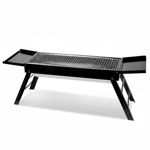 Black portable grill on a white background