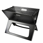 Black portable grill with X-shaped design on a white background